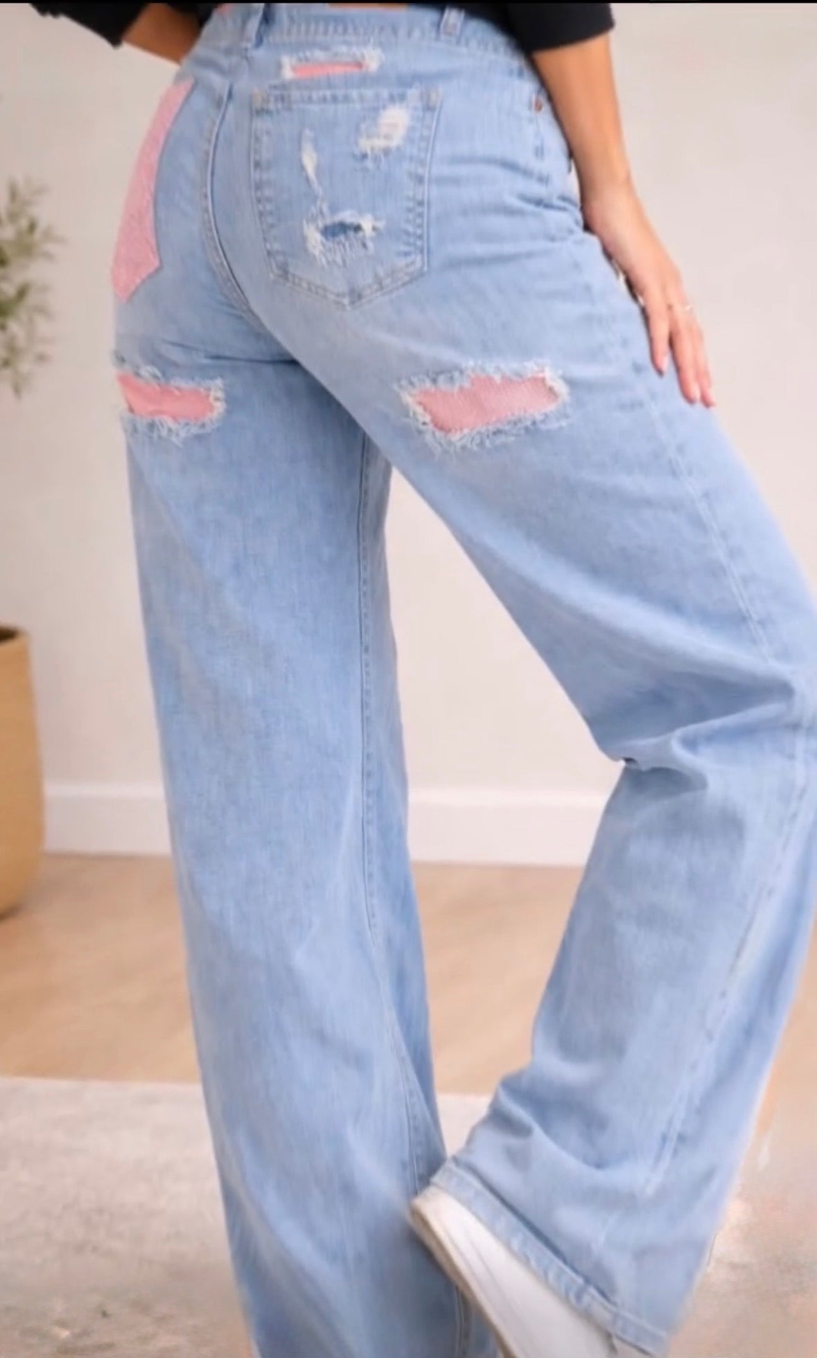 Jeans met roze glitter zak