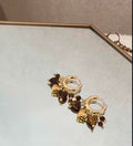By Shir |  Oorbellen klein bohemian hartjes bruin